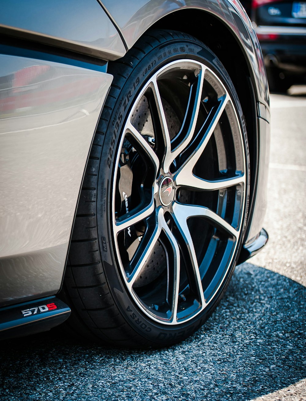 chrome multi-spoke wheel and black tire