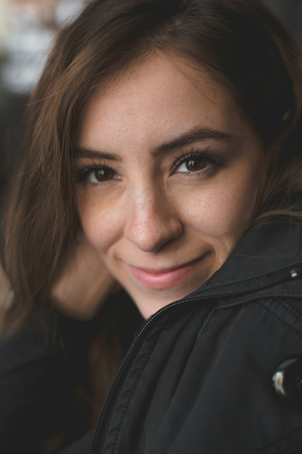 smiling woman wearing black jacket