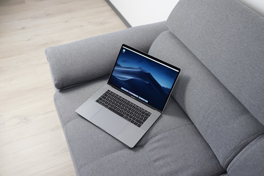 MacBook Pro on gray sofa