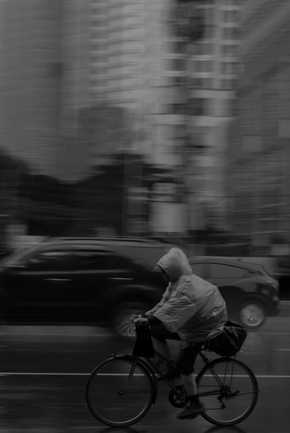 grayscale photography of person riding bike