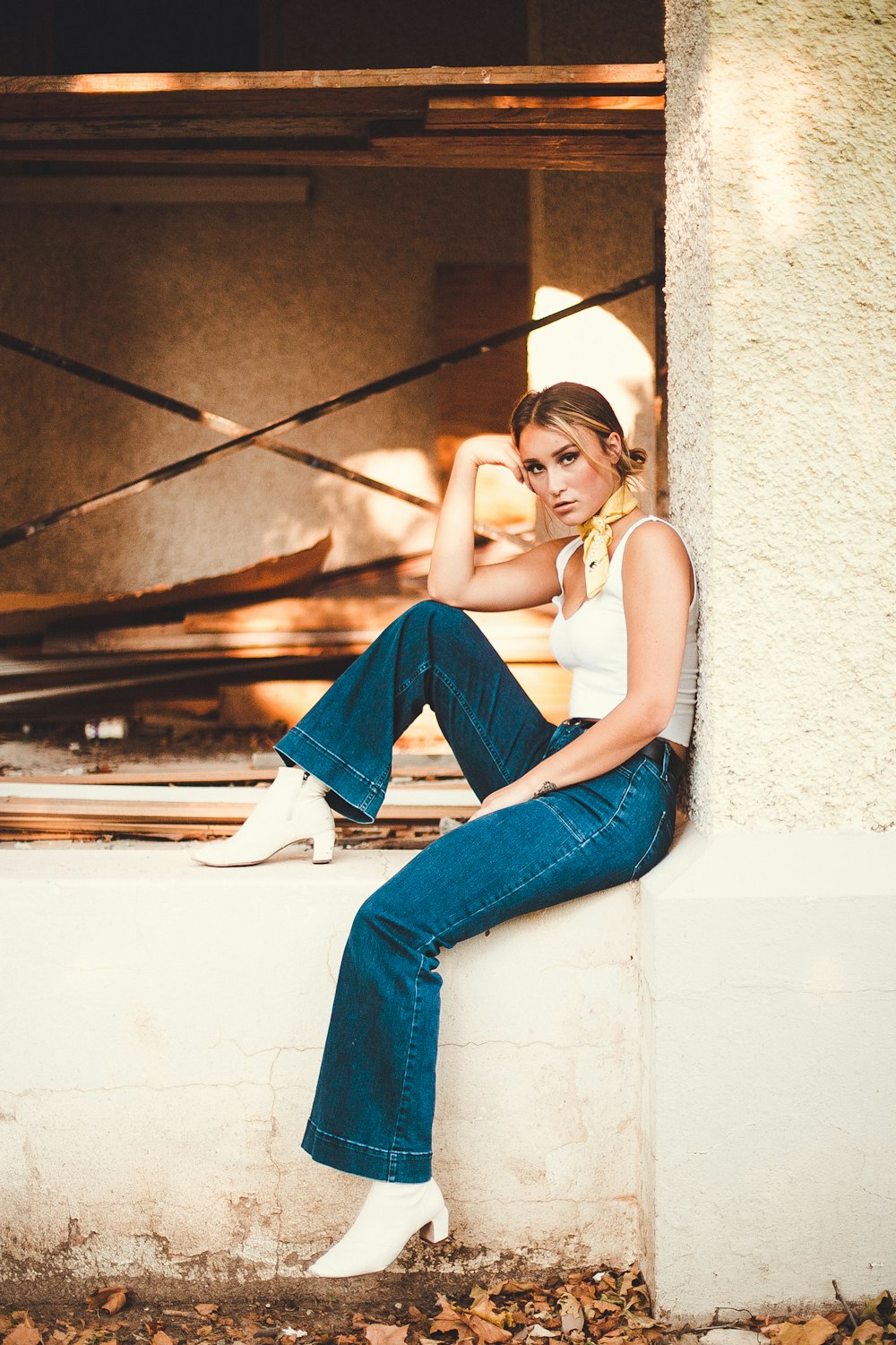 woman sitting on concrete building outdoor