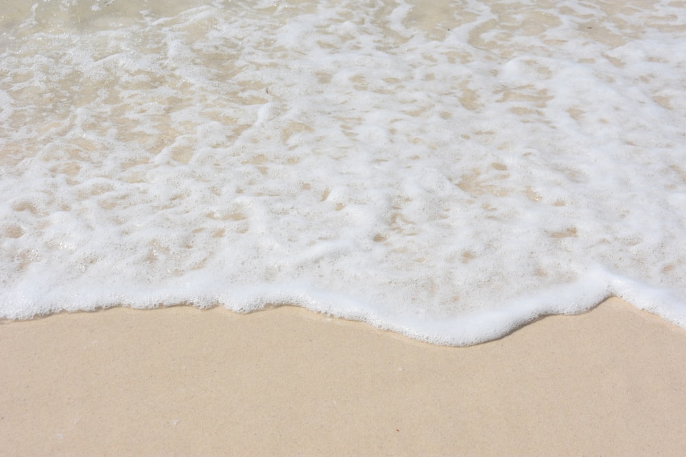 sea waves beside seashore