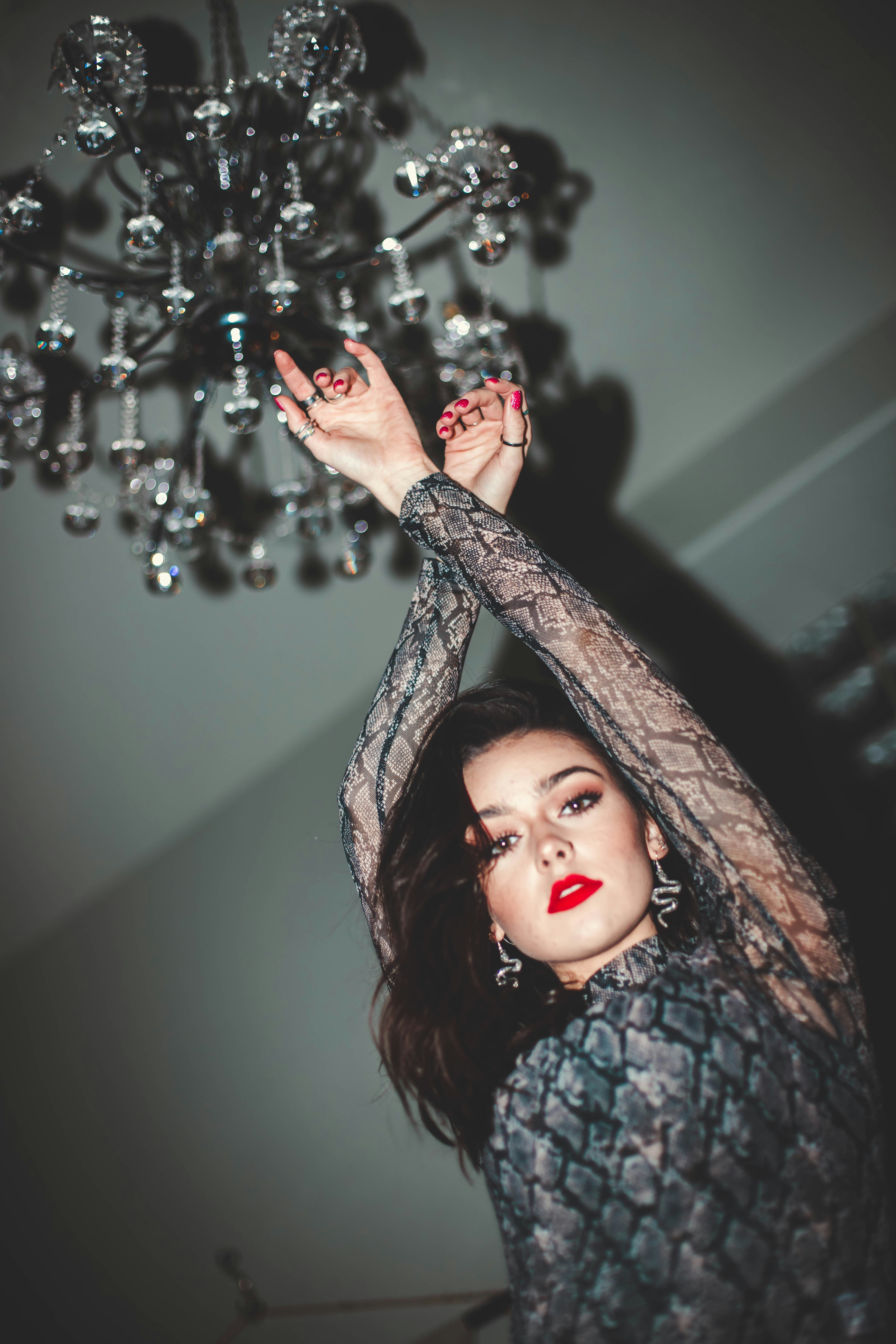 woman holding chandelier