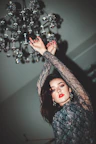 woman holding chandelier