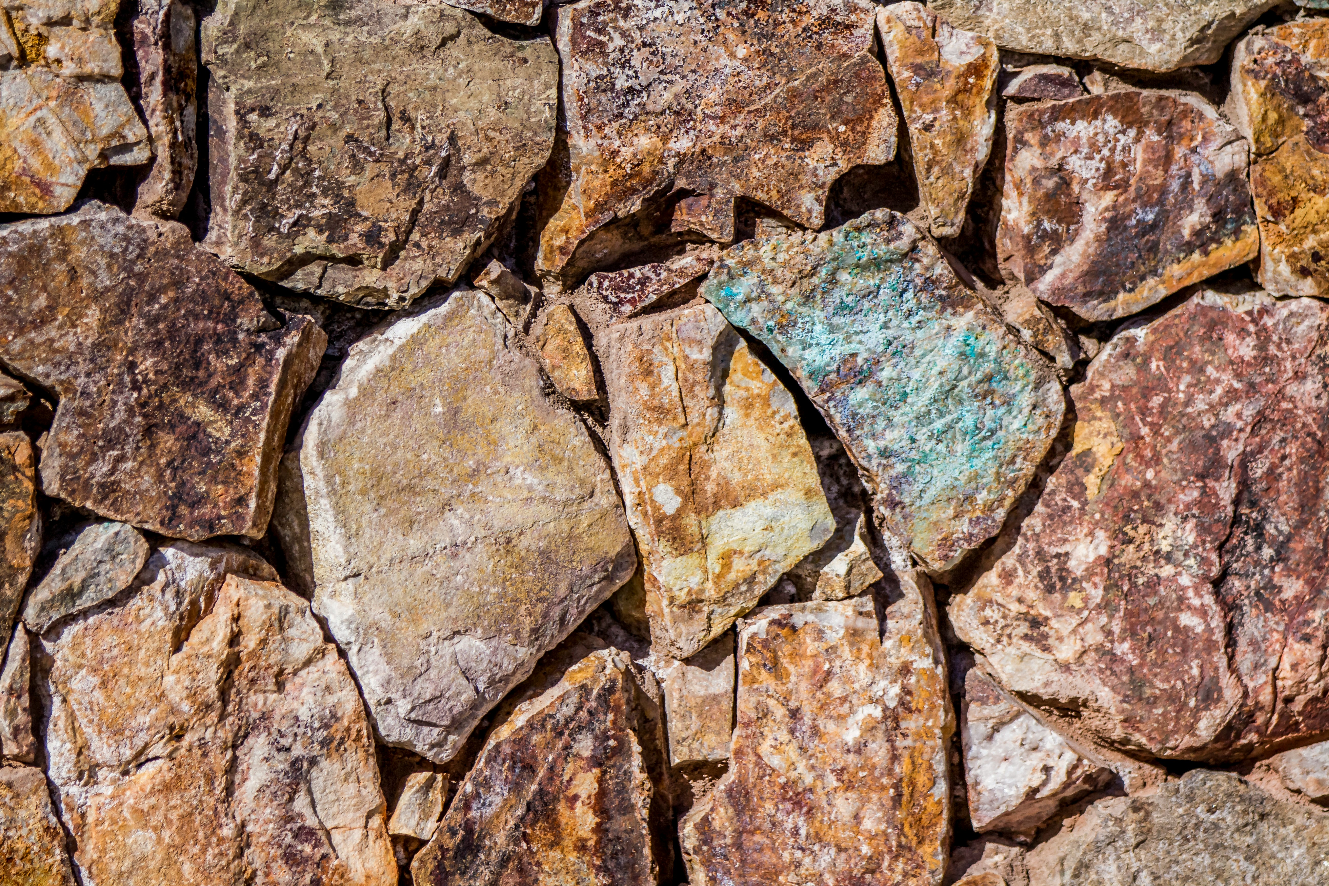 close up photo of assorted-colored piled rocks