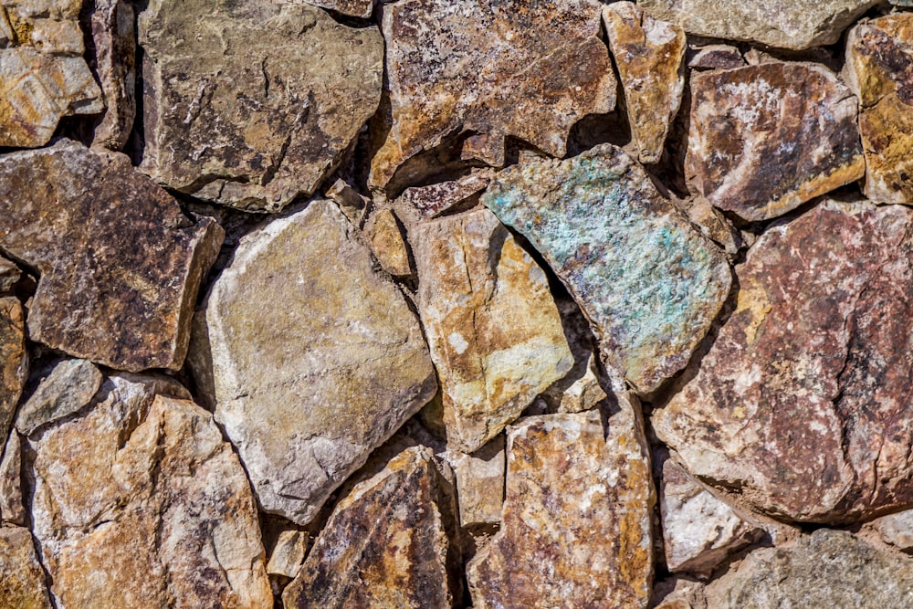 close up photo of assorted-colored piled rocks