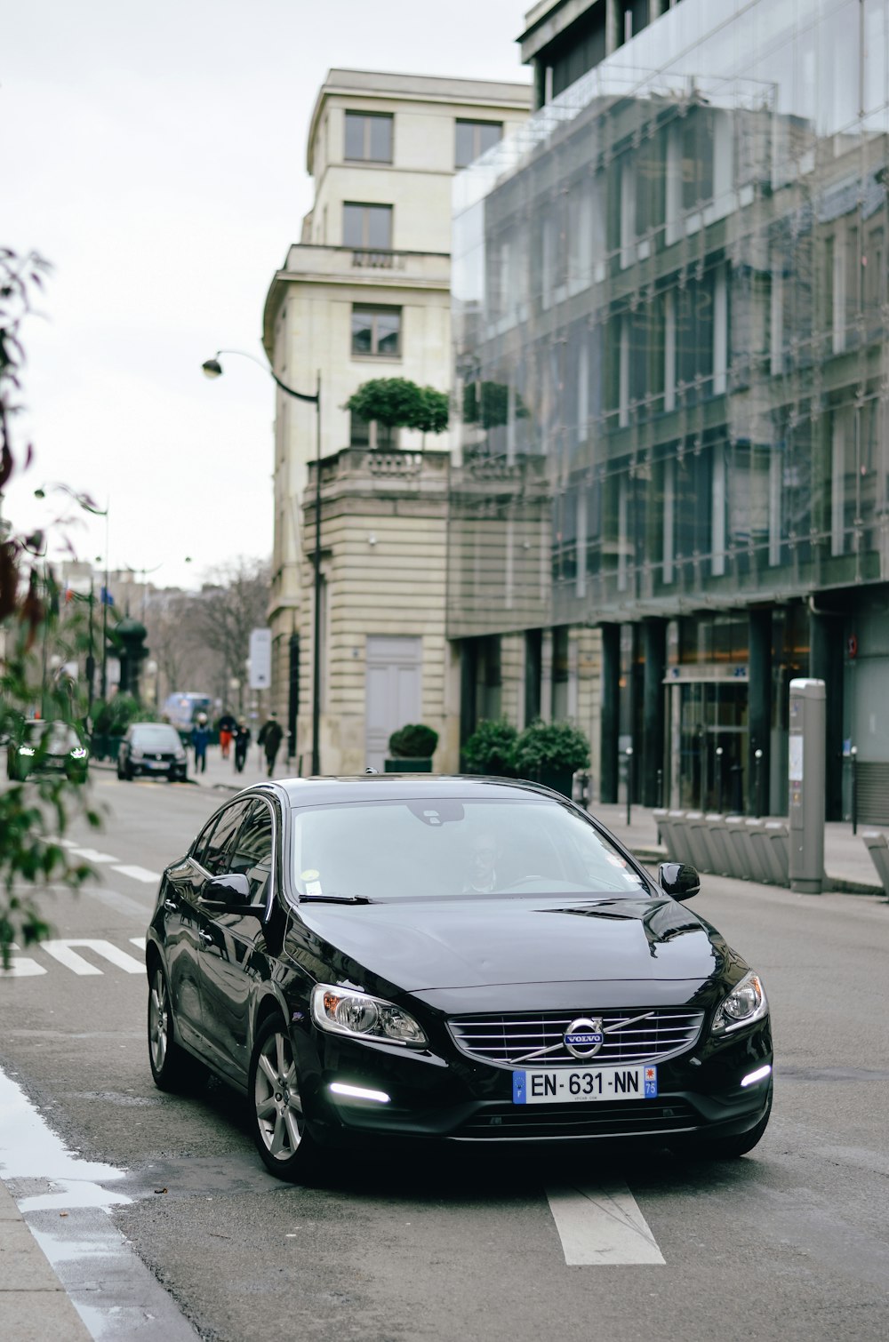 black Volvo S-series sedan on road during daytime