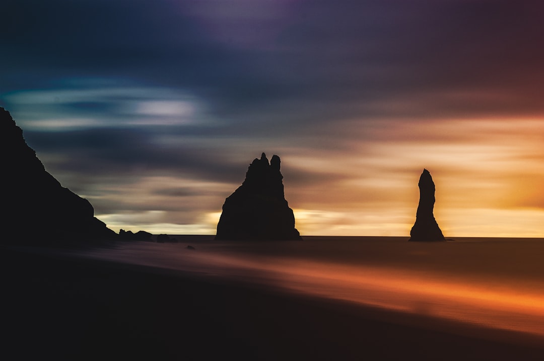 silhouette of rock formation during golden hour