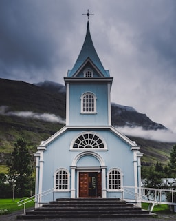 blue and white wooden church during daytime
