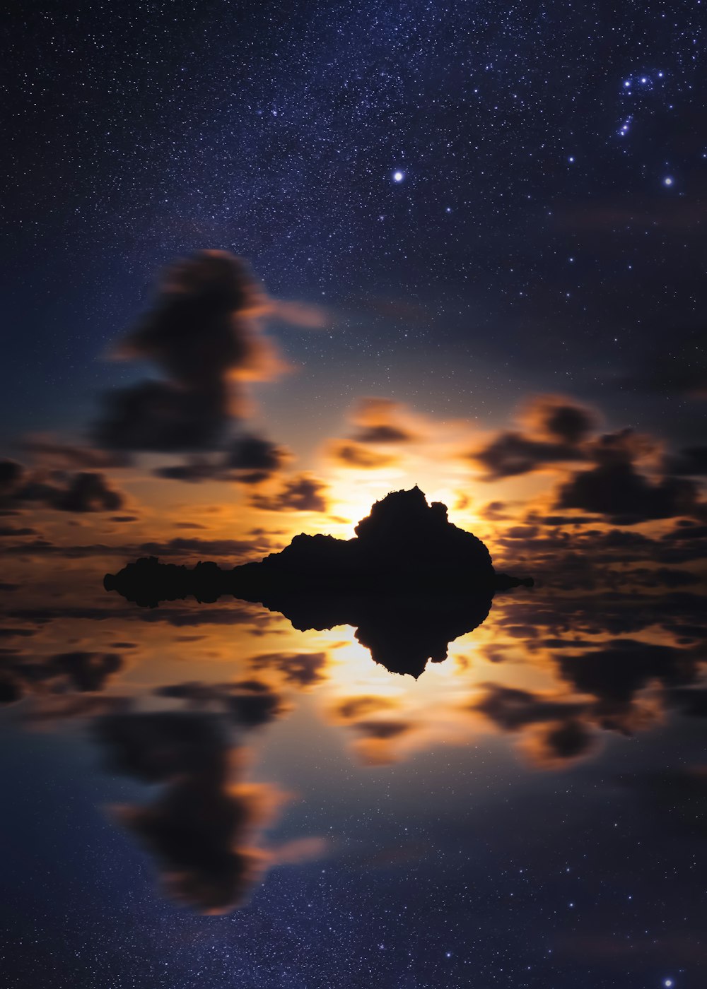 silhouette of islet during golden hour