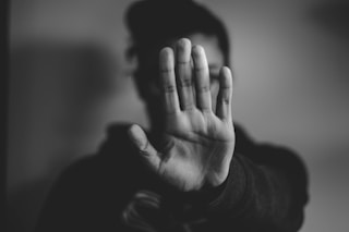 close-up photography of person lifting hands