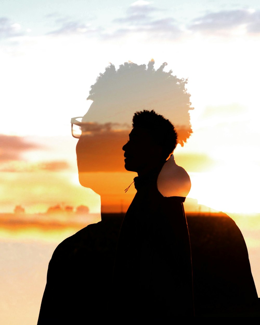 silhouette of man during golden hour