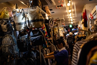Brightly colored school backpacks neatly displayed on shelves in a cozy store corner