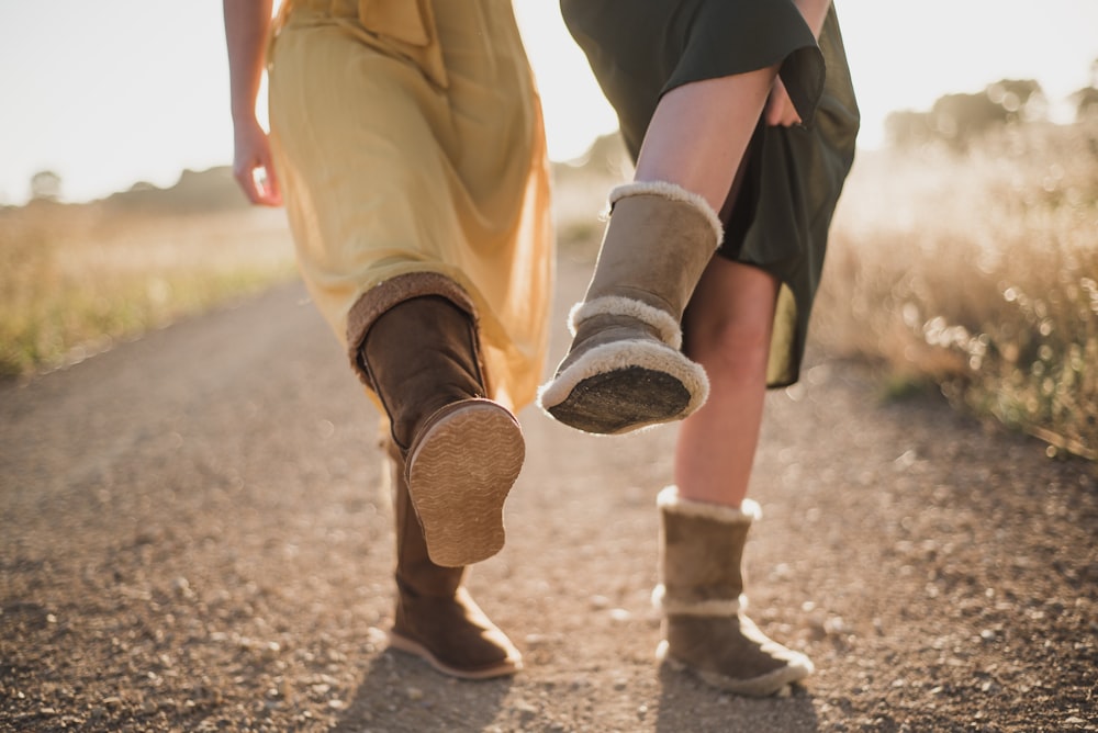 two person raising both right legs