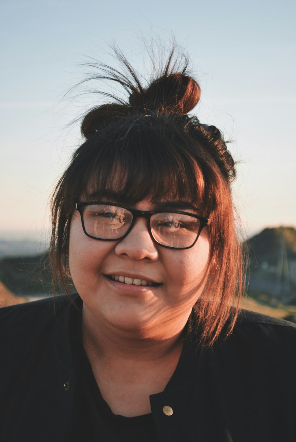 woman wearing black-framed eyeglasses