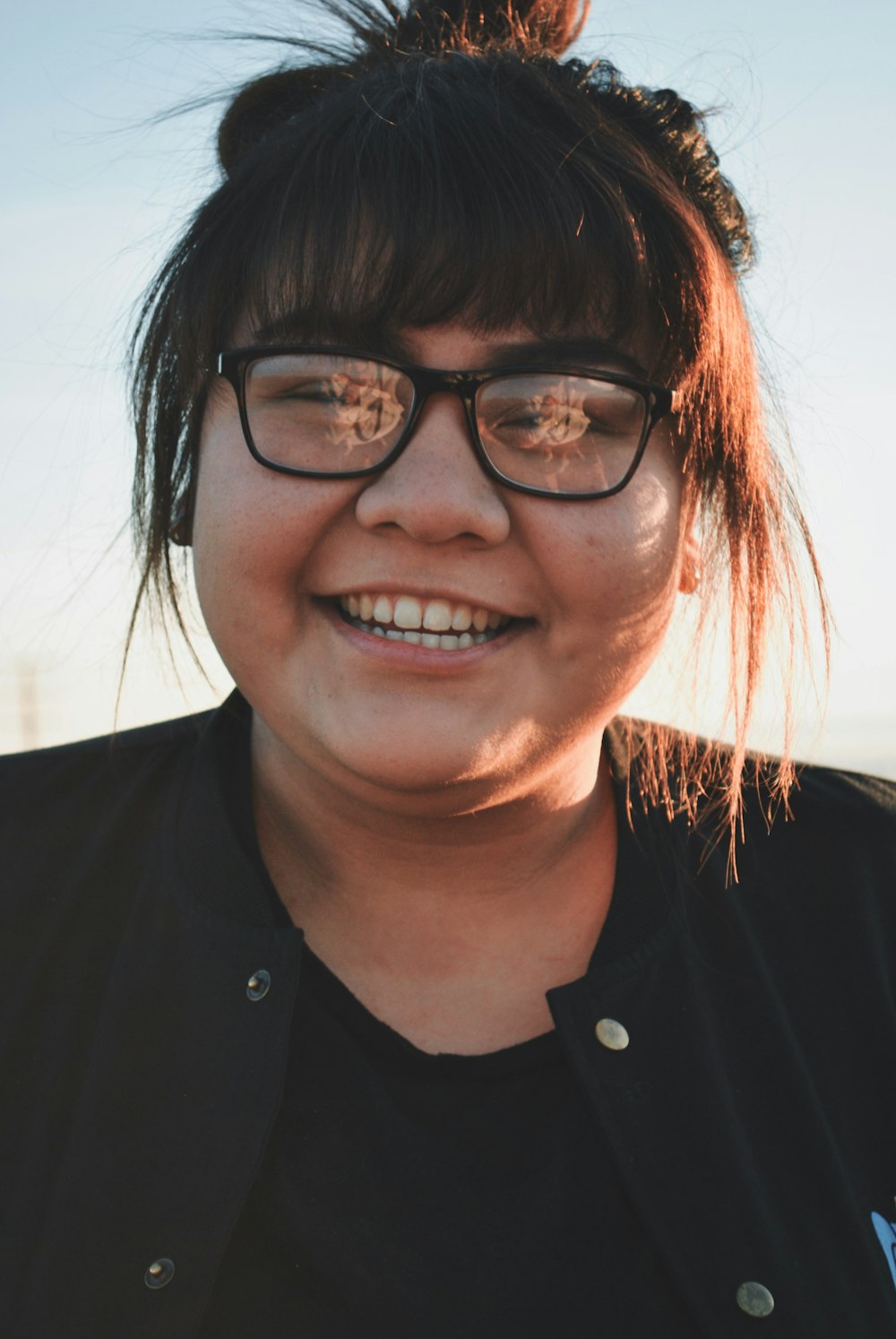 smiling woman wearing sunglasses