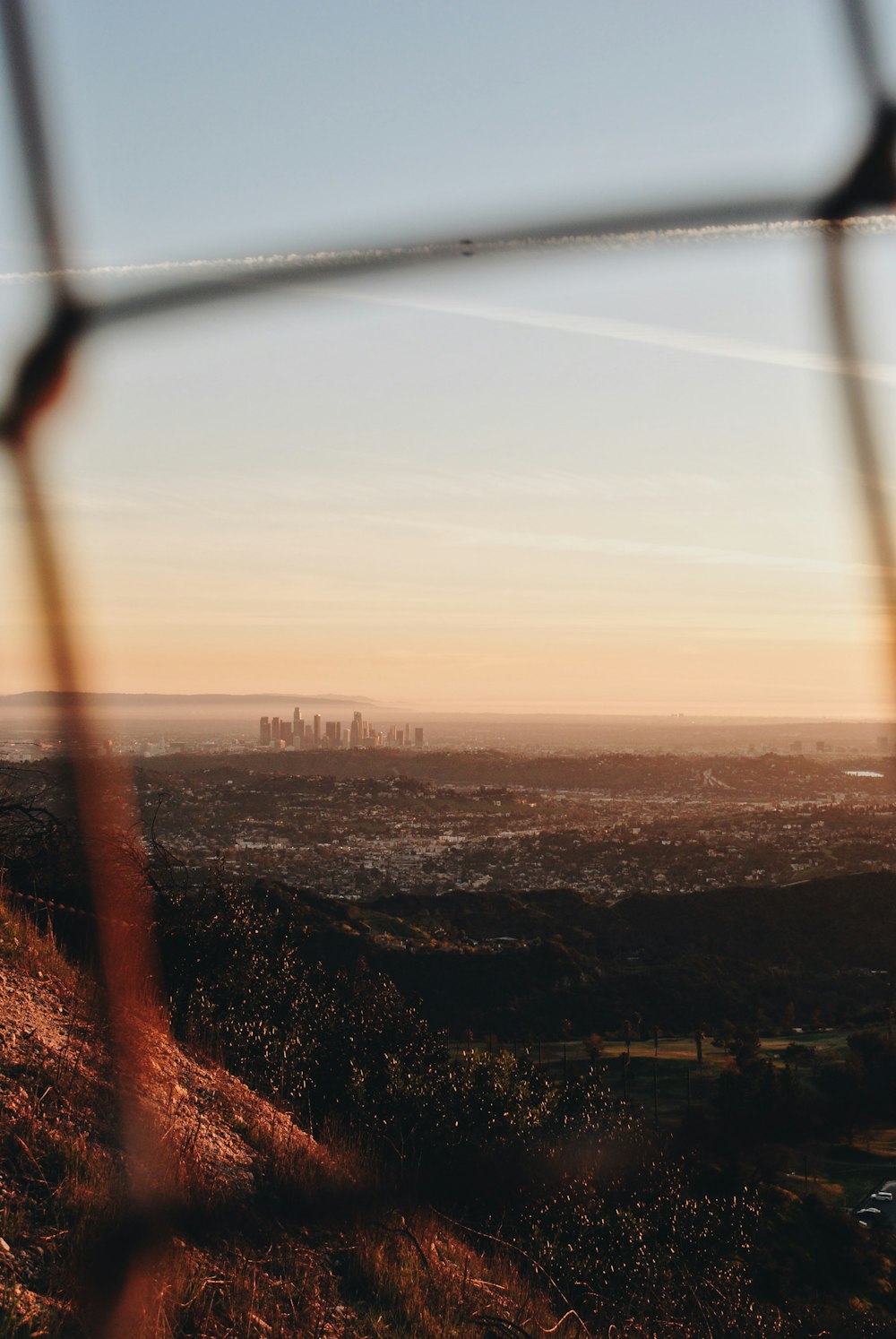 city view from chain link fence