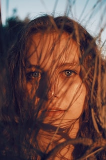 A striking close-up of a person’s eyes reflecting a sunrise, symbolizing awakening potential.