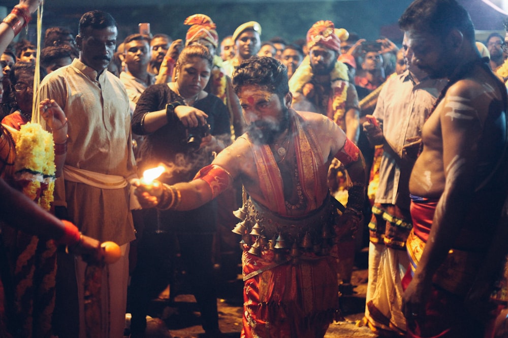 people wearing traditional dress at night