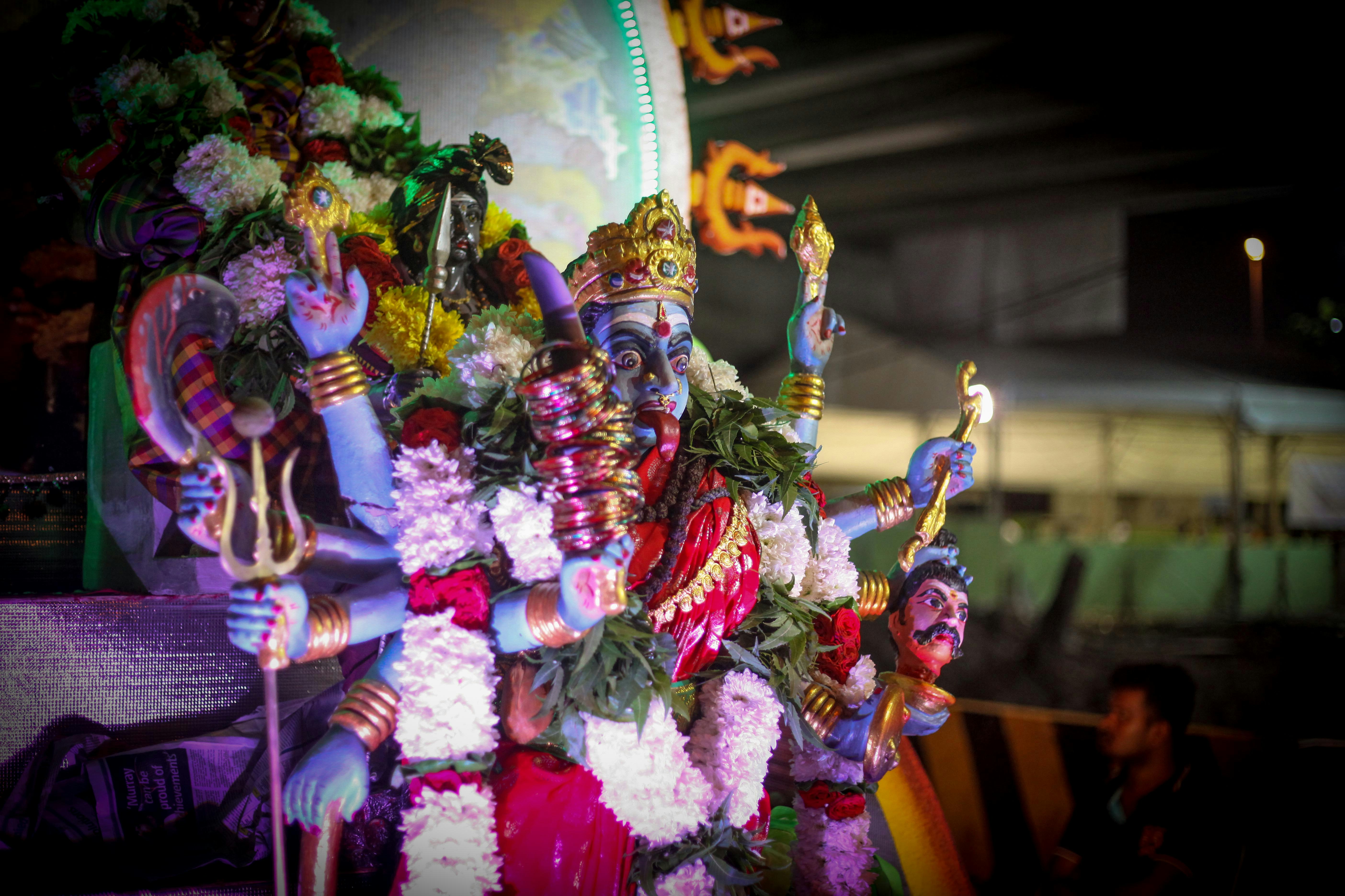 hindu deity at night mardi gras teams background