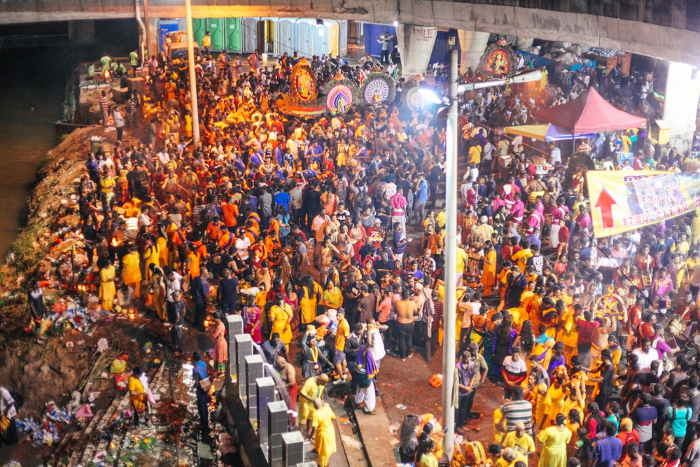 crowd near river during night time