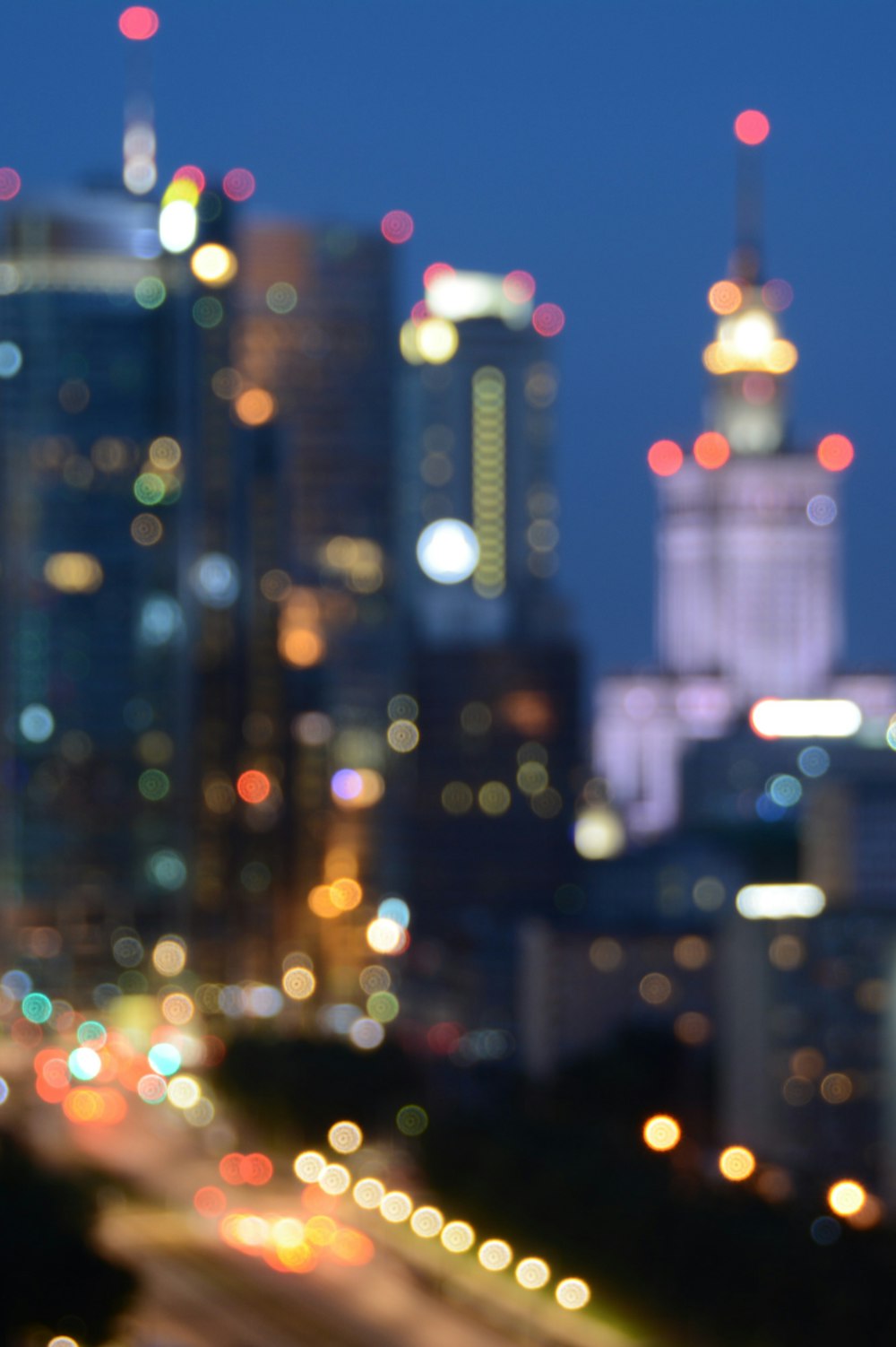 bokeh photography of high-rise buildings