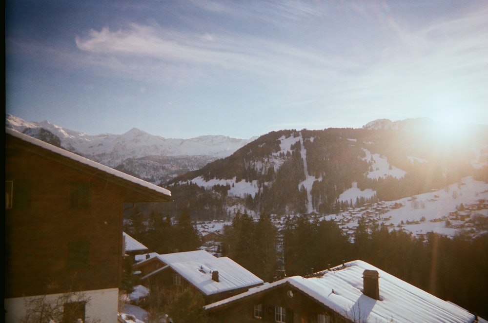 houses beside mountains during daytime