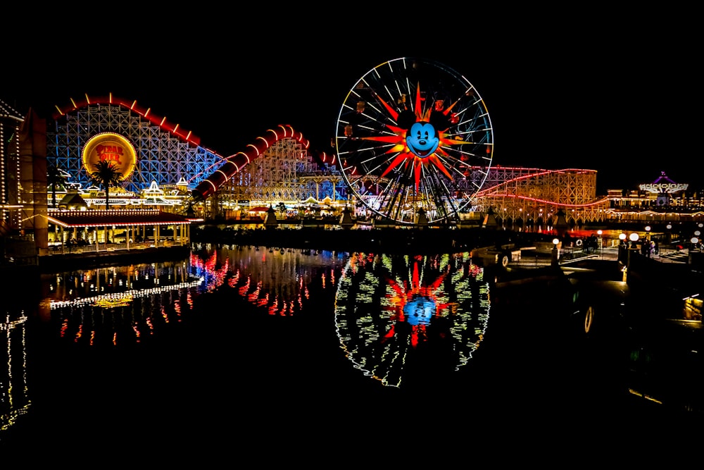 photo of lighted amusement park at night