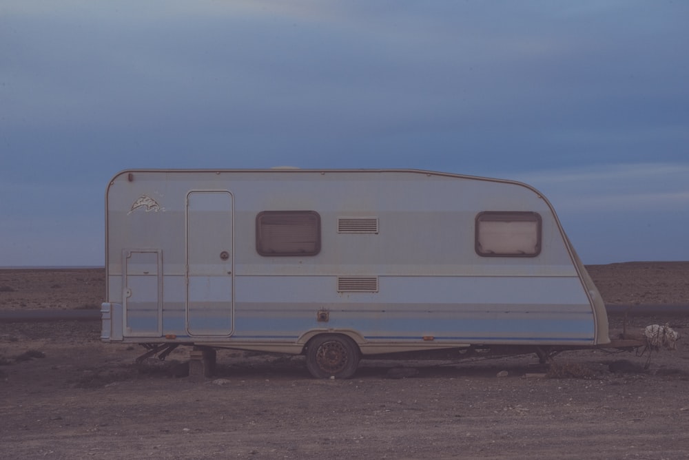 white camper trailer on desert