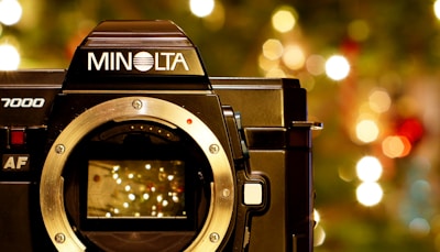 Close-up of a camera lens focusing on a joyful celebration.
