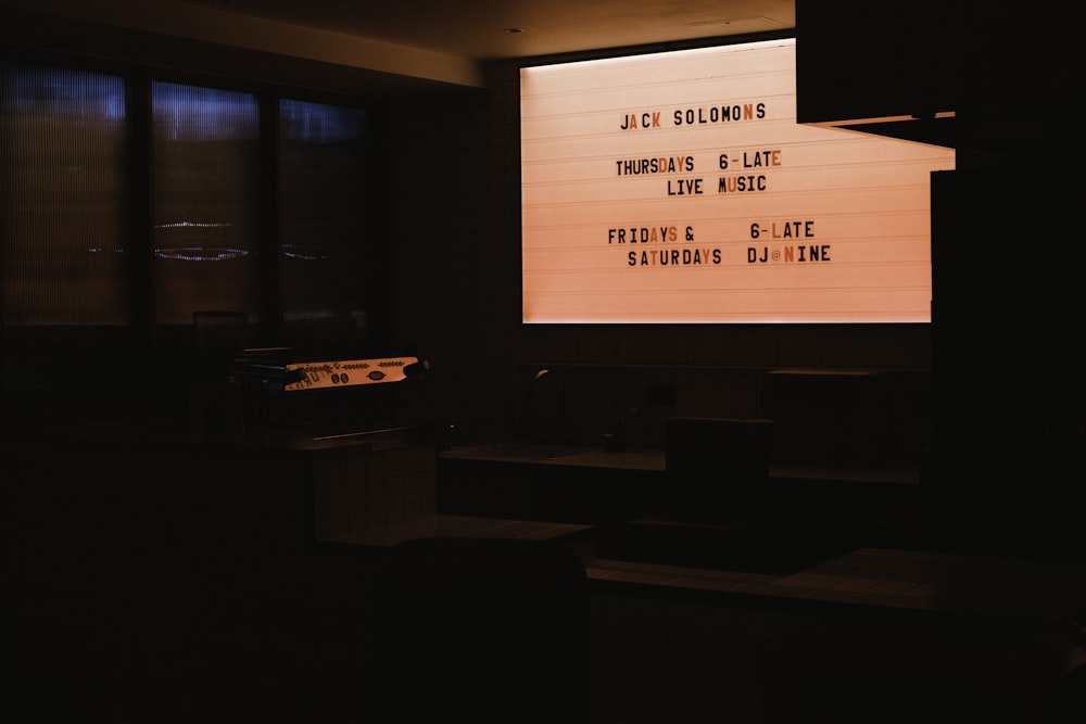 a large projection screen in a dark room