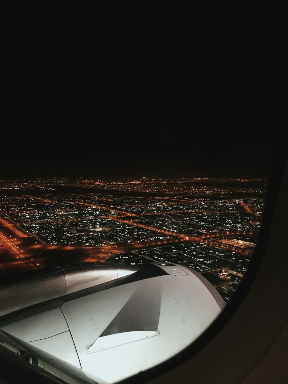 aerial view of city through plane's window