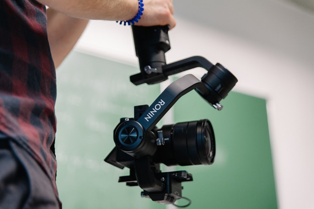 person holding Ronin camera mount