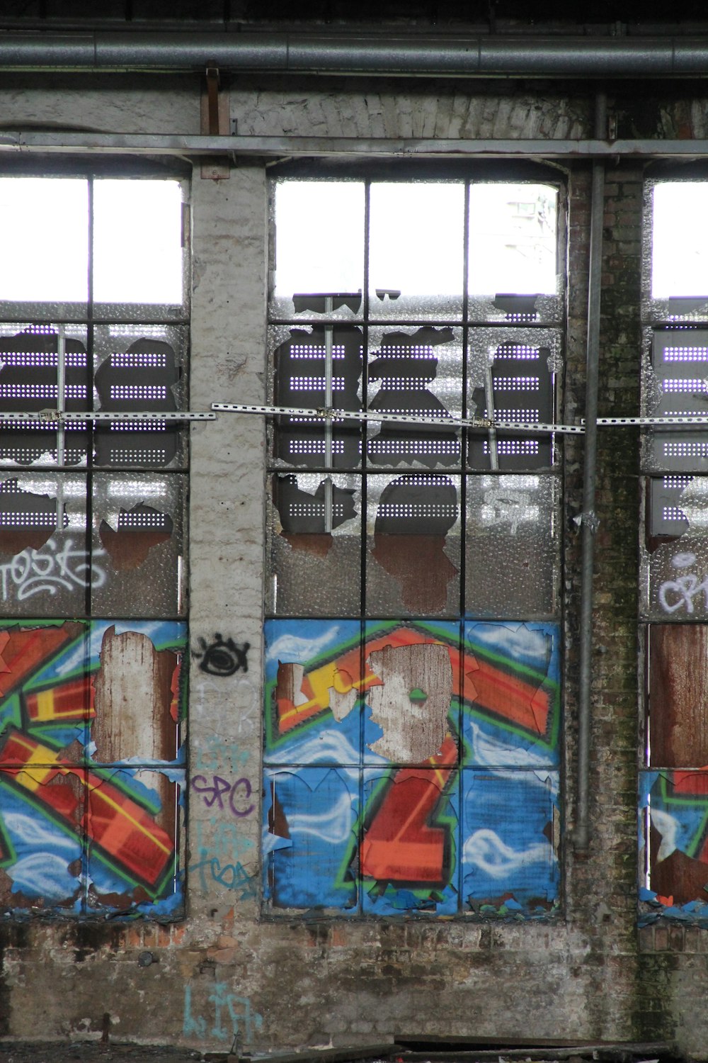 clear glass window with graffiti artwork