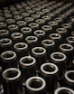 a large group of metal flanges sitting on top of a table