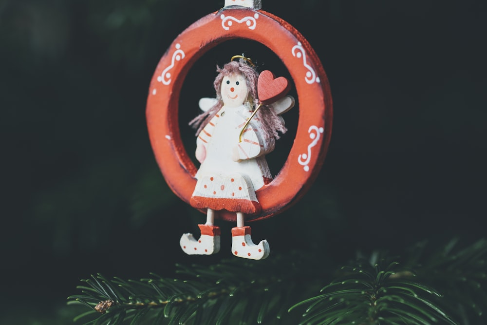 girl sitting on ring hanging decor