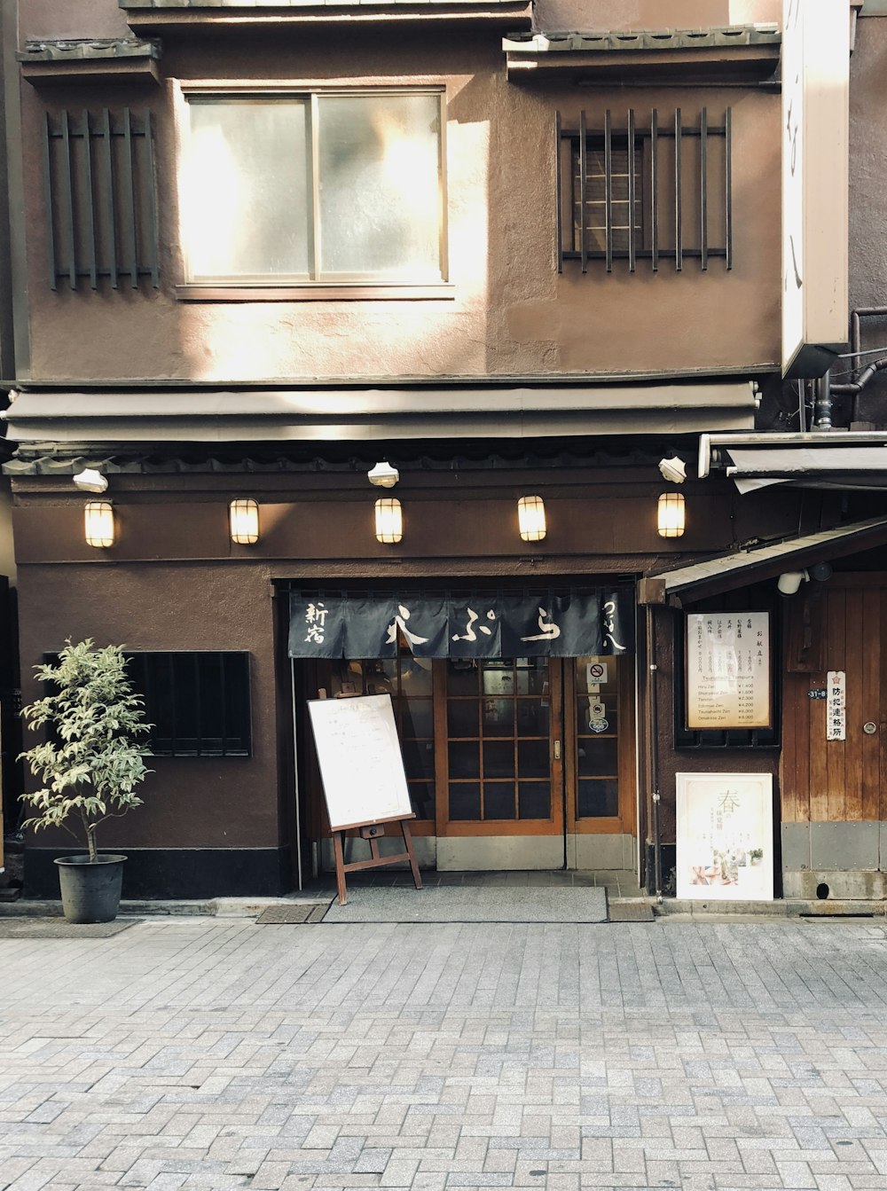 brown storefront during daytime