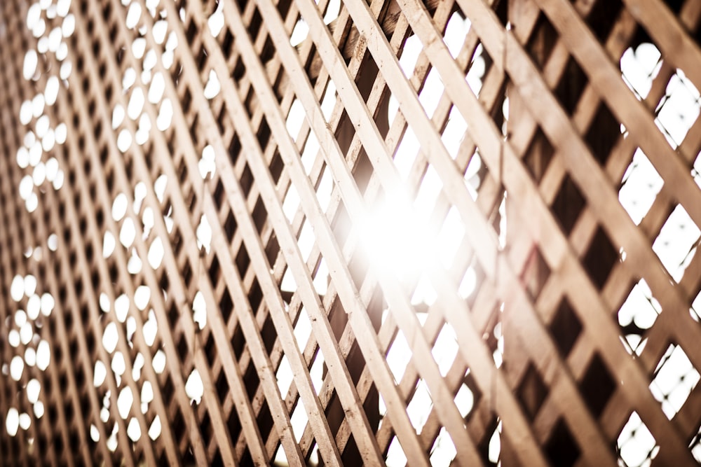 the sun is shining through the latticed wall