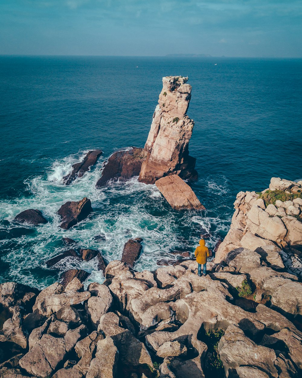 rock formation on body of water