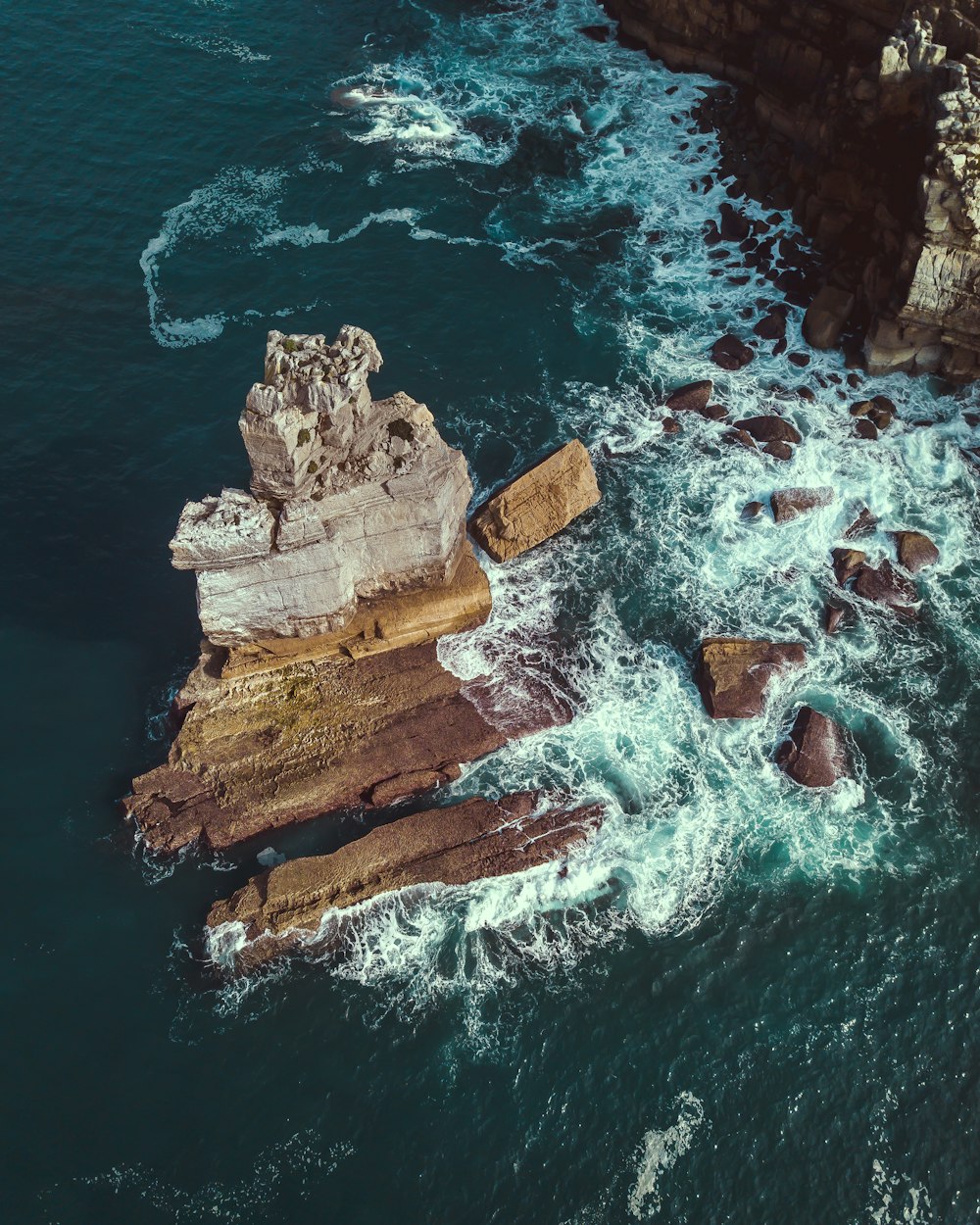 rock formations on body of water