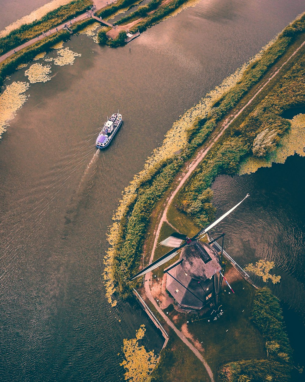 black and blue boat on body of water