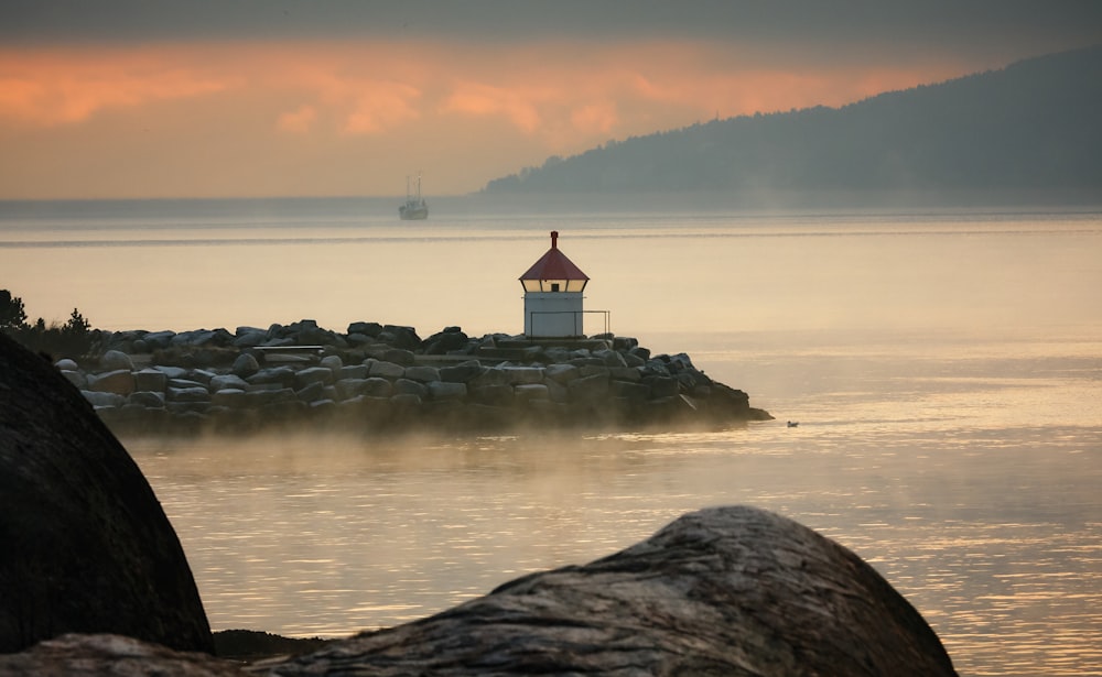 white lighthouse during olden hour