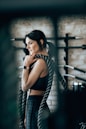woman holding black rope