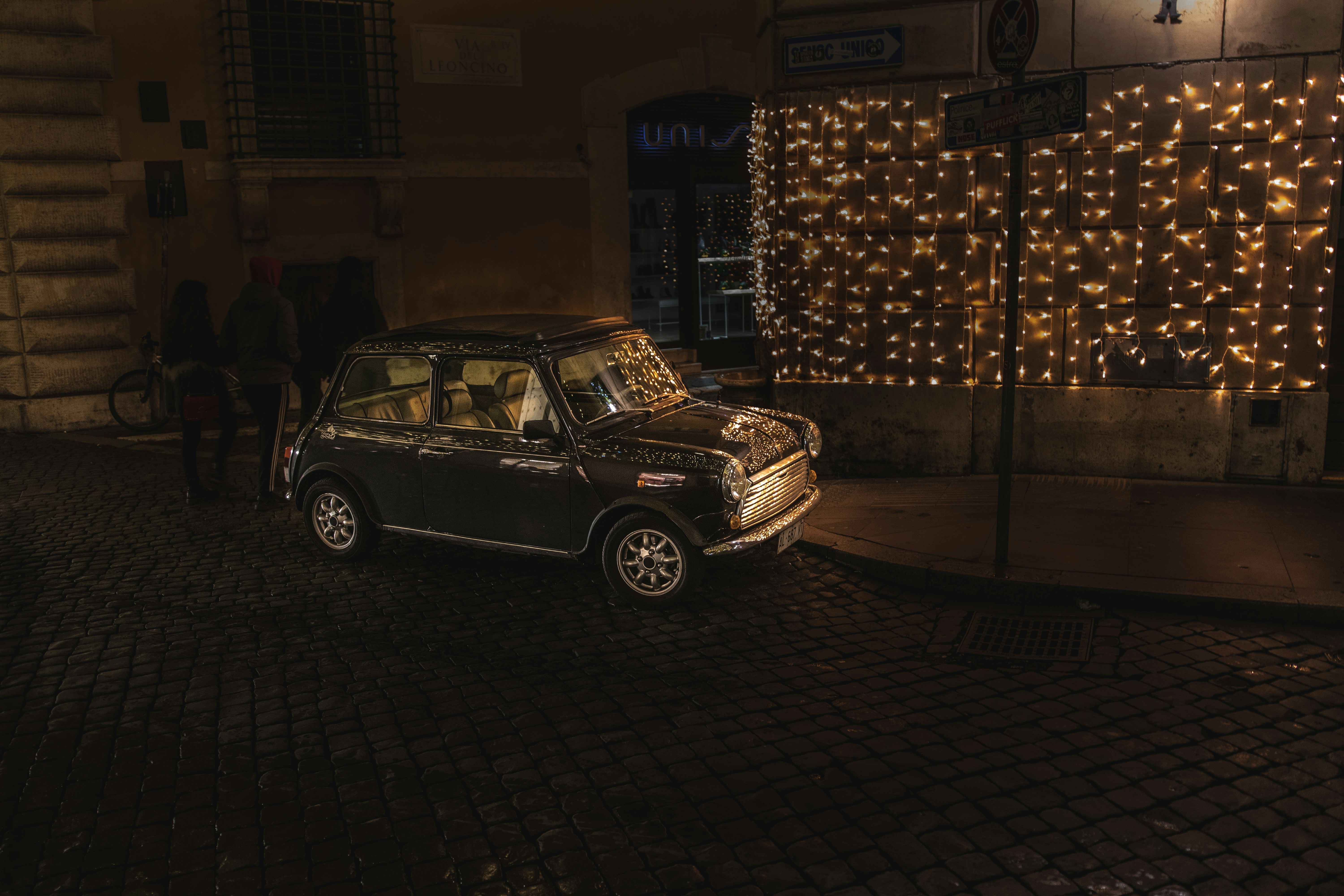 black car parked near string lights, Mini!