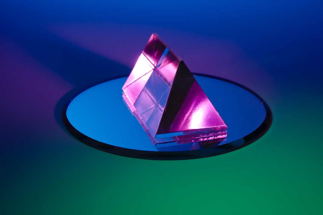 purple gemstone, Photograph of a prism and a mirror.<p></figure>As Graphic as this looks, there is very little post-processing involved!</p><p>Check my collection of similar photos on Unsplash in my FLASH AND COLOR collection here: https://unsplash.com/collections/4365614/flash-and-color-by-lazy-creek