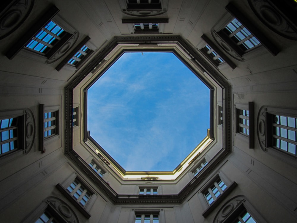 low-angle photography of concrete octagonal building during daytime