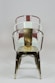 three red, white, and black metal armchairs