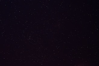 a night sky with a few stars in it
