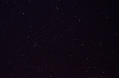 a night sky with a few stars in it