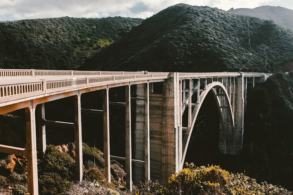 concrete bridge near mountains